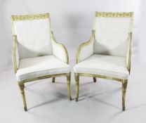 A decorative pair of cream painted Continental armchairs A decorative pair of cream painted