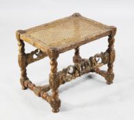 A William and Mary carved oak stool, A William and Mary carved oak stool, with cane top, the