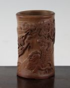 A Chinese bamboo brushpot, 4.8in. A Chinese bamboo brushpot, carved in relief with a scholar beneath