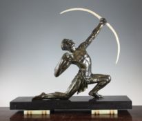 An Art Deco patinated metal figure of a male archer, 24in. An Art Deco patinated metal figure of a