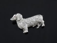 A white gold, diamond and ruby set brooch, modelled as a dachshund, 1.5in. A white gold, diamond and