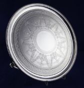 An ornate Victorian silver salver, 41 oz. An ornate Victorian silver salver, of circular form,