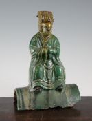 A Chinese green glazed pottery figural ridge tile, probably Ming dynasty, 11.25in. (28.5cm) A