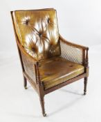 A 19th century mahogany bergere library chair, A 19th century mahogany bergere library chair, with
