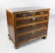 An 18th century oyster veneered chest W.3ft 4in. An 18th century oyster veneered chest of two