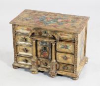 An Italian floral painted table top cabinet, 16in. An Italian floral painted table top cabinet, with