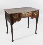 An 18th century oak lowboy, W.2ft 8in. An 18th century oak lowboy, fitted three drawers with
