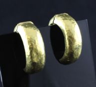 A pair of 22ct gold hinged ear clips, A pair of 22ct gold hinged ear clips, of planished circular