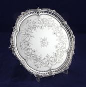 A Victorian silver waiter, 10.5 oz. A Victorian silver waiter, of shaped circular form, with