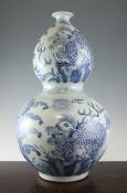A large Chinese blue and white double gourd shaped vase, 21.5in. (54.5cm) A large Chinese blue and