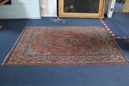 A Persian rug, 7ft 1in by 4ft 7in. A Persian rug, with three central medallions in a field of