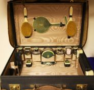 A 1920`s silver, ivory and shagreen mounted travelling toilet set, in Asprey fitted leather case,