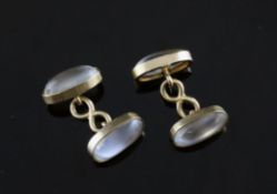 A pair of gold mounted oval moonstone cufflinks, A pair of gold mounted oval moonstone cufflinks,