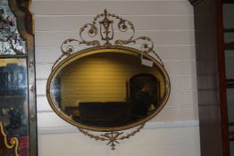 An Adams style gilt and gesso oval wall mirror, 2ft 7in. An Adams style gilt and gesso oval wall