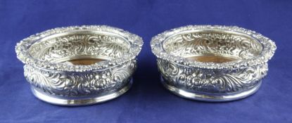 A pair of George IV silver circular wine coasters by R & S Garrard & Co, 6.25in. A pair of George IV