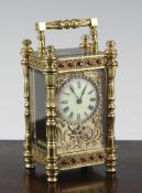 An Edwardian jewelled brass carriage timepiece, 5.25in. An Edwardian jewelled brass carriage