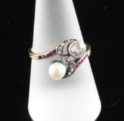 A gold, ruby, diamond and cultured pearl set crossover ring, size P. A gold, ruby, diamond and