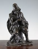 A 19th century French bronze figure of a seated hurdy gurdy player, 13in. A 19th century French