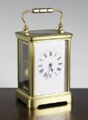 A French brass carriage clock, 6in. A French brass carriage clock, with enamelled Roman dial, 6in.