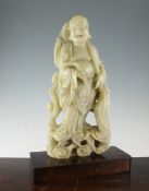 A large Chinese creamy coloured soapstone figure of a luohan A large Chinese creamy coloured