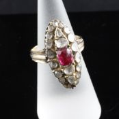 A gold, ruby? and diamond set marquise shaped dress ring, size L. A gold, ruby? and diamond set