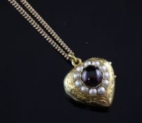 A gold, cabochon almandine garnet and split pearl set heart shaped locket, locket 0.75in (inc.
