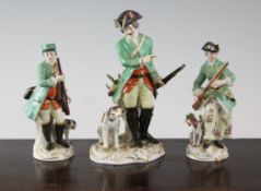 Three Meissen figures of hunters and their hounds, early 20th century, 5.3 - 7in., a.f. Three