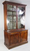 An early 19th century mahogany bookcase H.7ft An early 19th century mahogany bookcase with a pair of