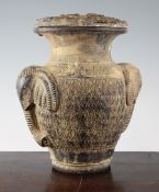 A Thai pottery vase, 10.5in. A Thai pottery vase, with elephant mask handles, containing a