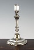 An 18th century cast Paktong candlestick, 10in. An 18th century cast Paktong candlestick, with