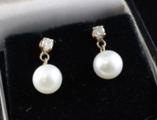 A pair of 14ct gold, diamond and cultured pearl set drop earrings. A pair of 14ct gold, diamond