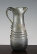 A Roman glass ewer, 2nd/3rd century AD, 9.5in. A Roman glass ewer, 2nd/3rd century AD, with