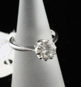 An 18ct white gold and solitaire diamond ring, size F An 18ct white gold and solitaire diamond ring,