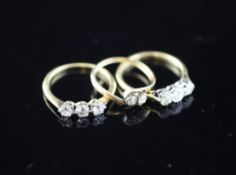 Three 18ct gold and diamond set dress rings, sizes K or M Three 18ct gold and diamond set dress