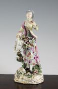 A Chelsea figure of a lady gardener, c.1760-5, 9.75in. A Chelsea figure of a lady gardener, c.1760-