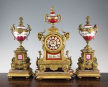 A late Victorian gilt metal and porcelain clock garniture, 17in. A late Victorian gilt metal and