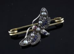 An early 20th century gold, diamond, sapphire, cabochon ruby and split pearl set butterfly brooch,