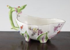 A Chelsea porcelain strawberry leaf sauceboat, c.1756, 6.75in., faults A Chelsea porcelain