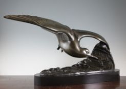 A large Art Deco patinated metal figure of a seagull on a crest of a wave, overall 34in. A large Art