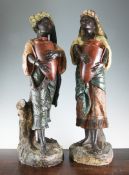 A pair of Austrian cold-painted terracotta figures of a Nubian man and woman, c.1900, 27.25in. A