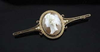 A cased Victorian 15ct gold and seed pearl mounted oval cameo bar brooch, 3in. A cased Victorian