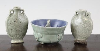A Chinese celadon glazed bowl and two snuff flasks, 19th century, largest 3.8in. (9.6cm) A Chinese