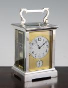 An early 20th century French silvered brass quarter repeating carriage alarum clock, 5.75in. An