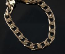 A 9ct gold curb link bracelet, A 9ct gold curb link bracelet, with two loose links, 30 grams.