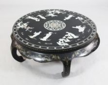 A Chinese circular black lacquer low occasional table, W.3ft A Chinese circular black lacquer low