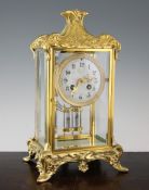 An early 20th century Art Nouveau French ormolu four glass mantel clock, 13.5in. An early 20th