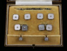 An 18ct gold, 9ct gold, mother of pearl and seed pearl dress stud set, in gilt tooled Mappin &