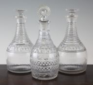 A pair of mallet decanters and stoppers and another, 9in. A pair of Regency cut glass mallet