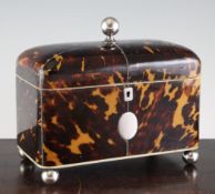 An early 19th century tortoiseshell two division tea caddy, 8in. An early 19th century tortoiseshell