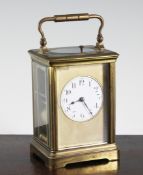 An Edwardian brass hour repeating carriage clock, 5.5in. An Edwardian brass hour repeating